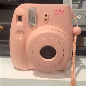 Fuji film instax Polaroid in baby pink